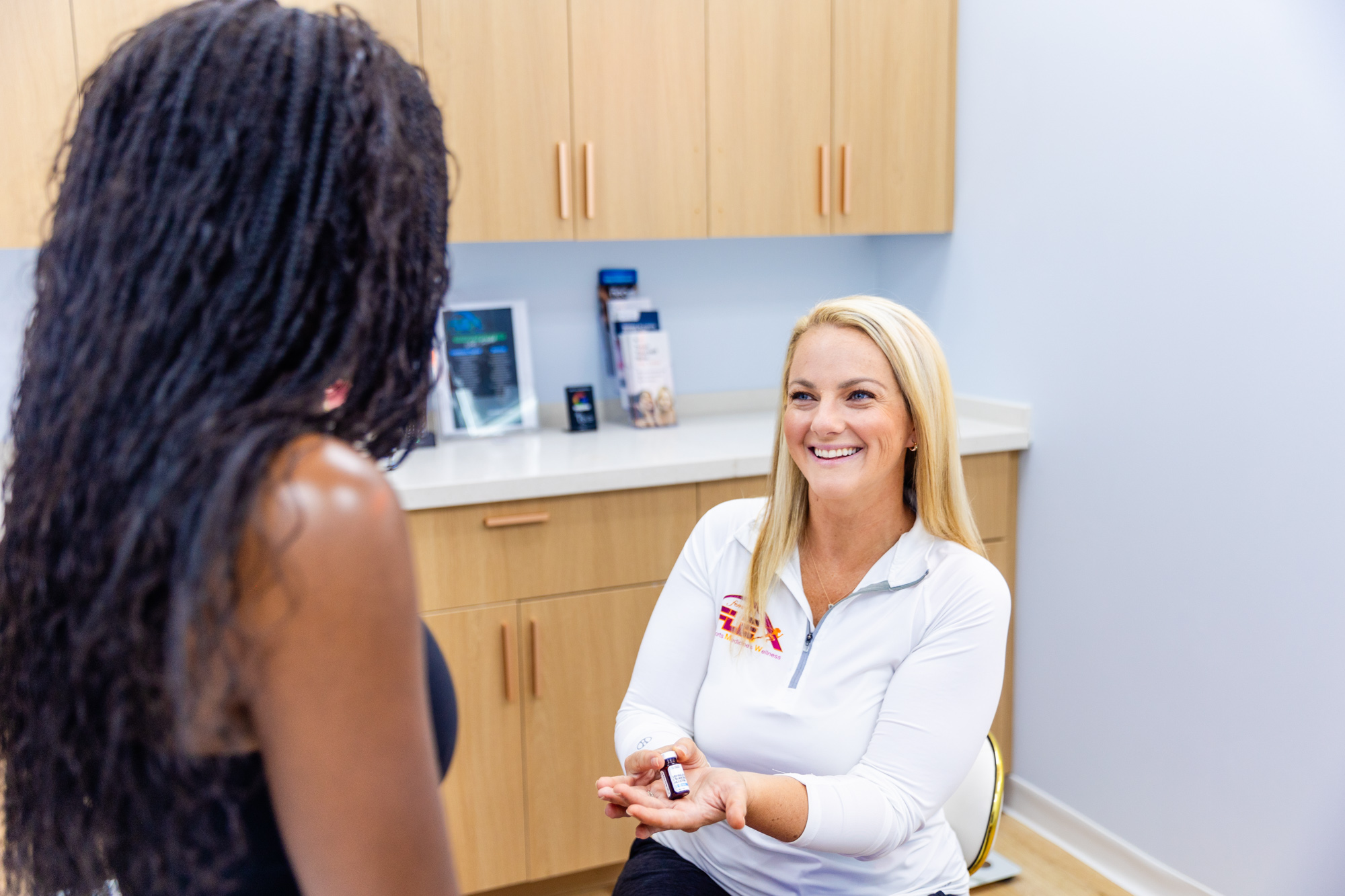 “Doctor administering a medication injection to a patient, ensuring proper technique in a safe and professional clinical environment.”